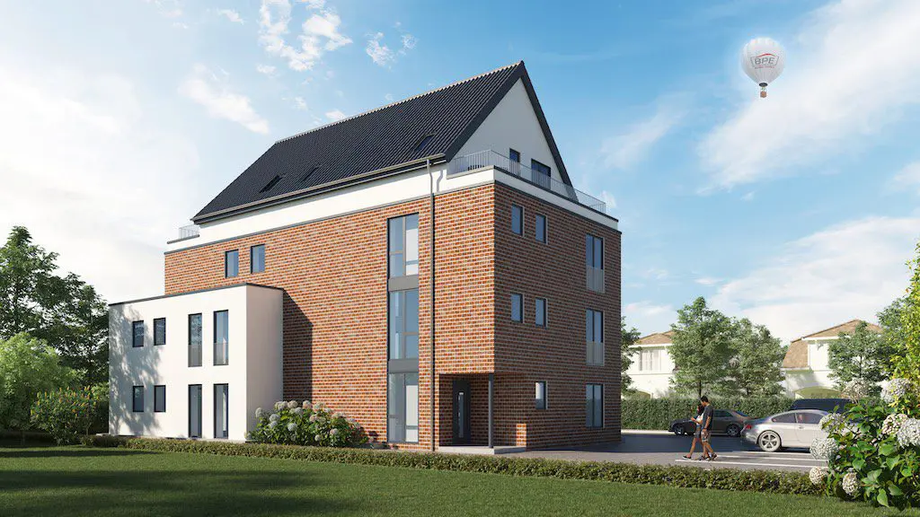 Ansicht eines modernen Mehrfamilienhauses mit Ziegelmauerwerk und dunklem Dach unter blauem Himmel.