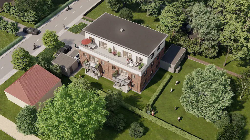 Vogelperspektive eines modernen Mehrfamilienhauses mit Balkonen und Dachterrasse, umgeben von Grünflächen.